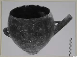 Pottery Red Polished I (Vounous 90.32), a round-bodied vessel with a loop handle and a tubular spout