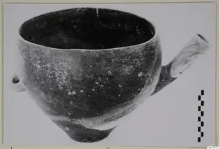 Pottery bowl, Red Polished I, with a tubular spout to the right and a small loop handle on the left