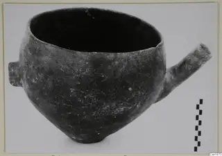 Red Polished I pottery vessel from Vounous with a tubular spout, shown with a scale bar