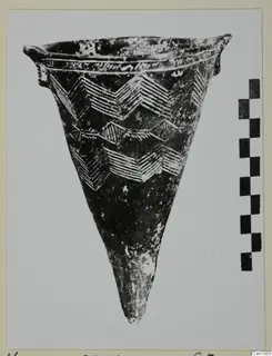 Conical pottery vessel with two small lugs and incised chevron bands, from Vounous