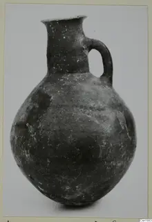 Pottery Red Polished I jug with one handle and a flared rim, from Vounous
