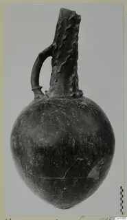 Red Polished I jug from Vounous with a loop handle and a tall, ridged neck