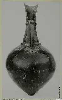 Pottery vessel, Red Polished I Stewart, from Vounous, with a tall flaring neck and a strap handle.