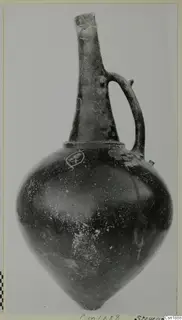 Pottery Red Polished I vessel with tall neck, single handle and incised decoration