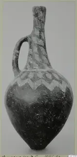 Jug with a single loop handle, a tall neck and white painted chevron bands, from Vounous