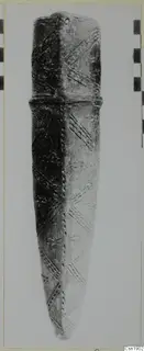 Pottery Red Polished I: elongated object with diagonal incised bands and a raised ridge near the top
