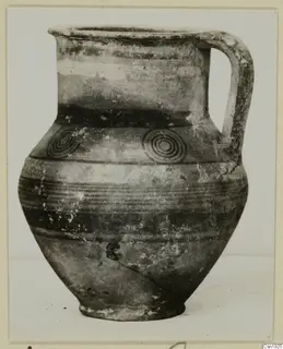 Jug with a loop handle, banded body and two concentric-circle motifs on the shoulder, from Idalion