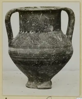 Two-handled pottery vessel with concentric circle motifs and horizontal bands, from Idalion