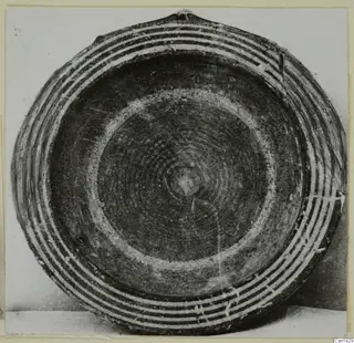 Bowl seen from above with concentric pale and dark painted bands around the rim and a ring pattern in the centre