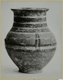 Painted pottery jar with a flaring rim and horizontal bands of dark and light decoration