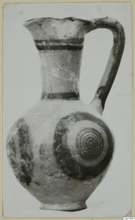 Jug with a single handle and concentric circles painted on its rounded body