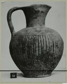 Black Slip jug with one handle and vertical grooves on the body, from the Kastros tombs at Lapithos