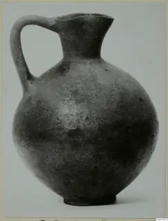 Pottery Black Slip I-VI jug with a single strap handle, from the Kastros tombs at Lapithos