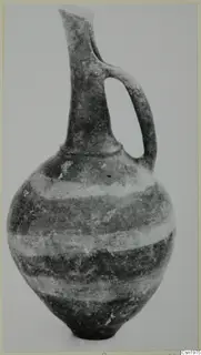 Pottery Reserved Ware jug with a long neck, single handle and banded body, from Vounous