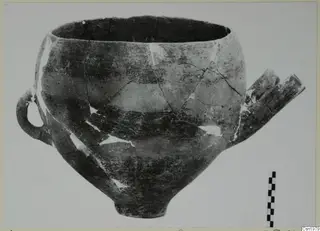 Pottery Reserved Ware vessel from Vounous 161, with a loop handle and a tubular projection