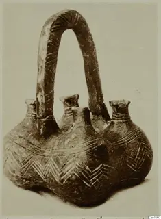 Red Polished III amphora from Vounous with three short necks and a tall arched strap handle