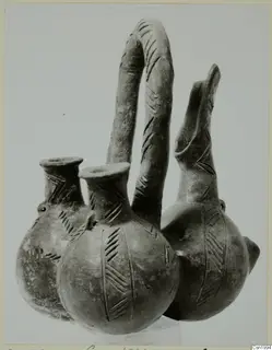 Pottery Red Polished III amphora: three joined vessels with a tall looped handle and incised chevron decoration