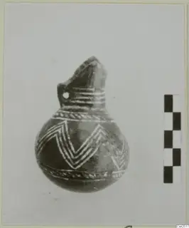 Pottery Red Polished II Bowl: a round-bodied vessel with a beaked neck and white painted chevrons on a dark surface