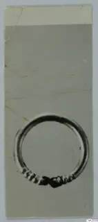 Ring from Marion: a closed metal ring with a ribbed, coiled section at the bottom where its ends meet