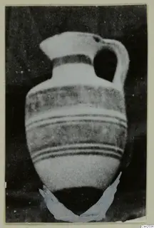 Pottery vessel, White Painted I amphora from the Kastros tombs at Lapithos, photographed against a dark background
