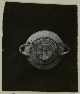 Pottery White Painted I bowl seen from above, with two loop handles and concentric painted bands
