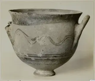 White Painted I bowl with a wavy painted band and two side handles, on a plain surface.
