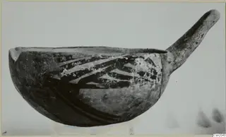 Pottery White Painted I - II: a bowl with one long handle and dark painted bands, seen from the side