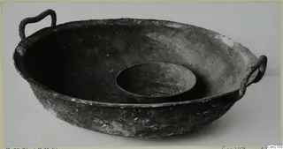 Two bowls: a large shallow bowl with two loop handles, with a smaller bowl set inside it