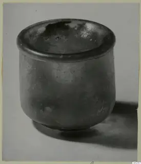Blown glass jar, a squat cylinder with a wide, flat rim