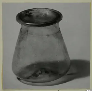 Blown glass vase with a flared rim and rounded body, photographed on a plain background.