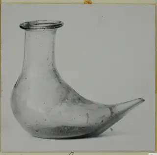 Blown glass container with a bird-shaped body, shown in side view against a plain background