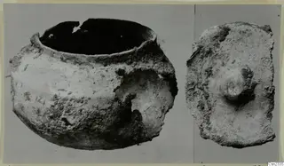 Corroded lead container and its lid from Marion, photographed side by side on a grey background