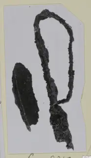 Corroded iron tools and tool parts, two dark fragments shown on a mounted card.