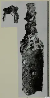 Two corroded iron tools, one long with a narrow upper end, the other a small bent fragment.