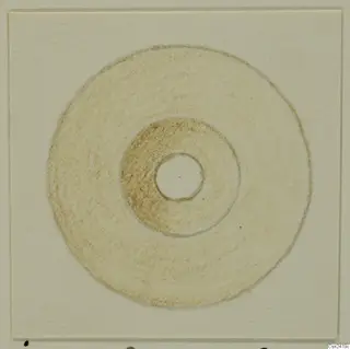 Drawing of a bone object: a flat disc with a central hole, shaded in brown, from Idalion