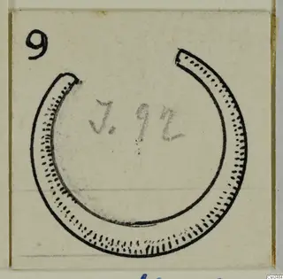 Drawing of an open ring-shaped ornament with dotted and dashed edges on a pale card