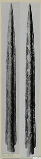 Two views of a long, pointed metal blade with a rough, corroded surface