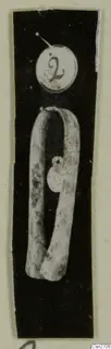 Bronze tool: a long metal bar bent into an open loop with a small disc attached, shown with a number label