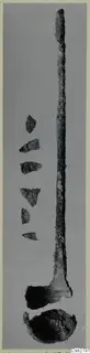 Bronze utensils: a long metal implement with a broad end, a bowl-shaped piece below, and small sherds beside it.