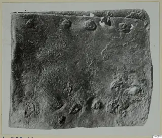 Corroded bronze object from Lapithos, Kastros tombs, close view of its pitted, crusted surface