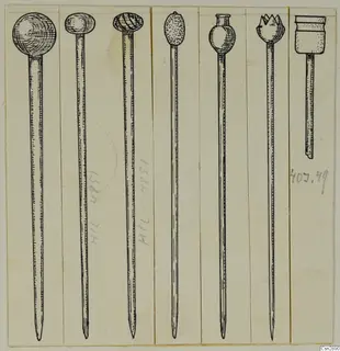 Drawing of several long pins with differently shaped heads, each in its own narrow vertical strip.