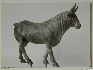 Animal figurine with curved horns, photographed after conservation