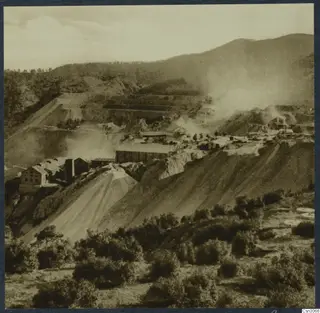 Mining complex with sheds, buildings and spoil slopes on hillsides, the Amiandos asbestos mine