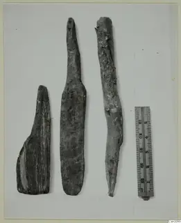 Three wooden tool pieces beside a ruler, from Cypriote mining
