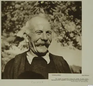 Portrait of Charalambos, a smiling older man with a moustache and open white collar