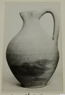 Pottery Plain White VI, a jug with a single loop handle, photographed on a card mount