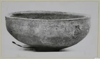 Pottery Plain White IV-V bowl, wide and shallow, photographed from the side
