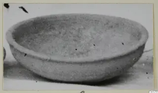 Pottery Plain White IV-V bowl, shallow and rounded, seen from the side