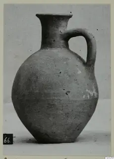 Pottery jug with a single loop handle and flared rim, from the Kastros tombs at Lapithos