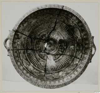 White Painted VII pottery shallow bowl with two handles, interior decorated with concentric bands and petal motifs